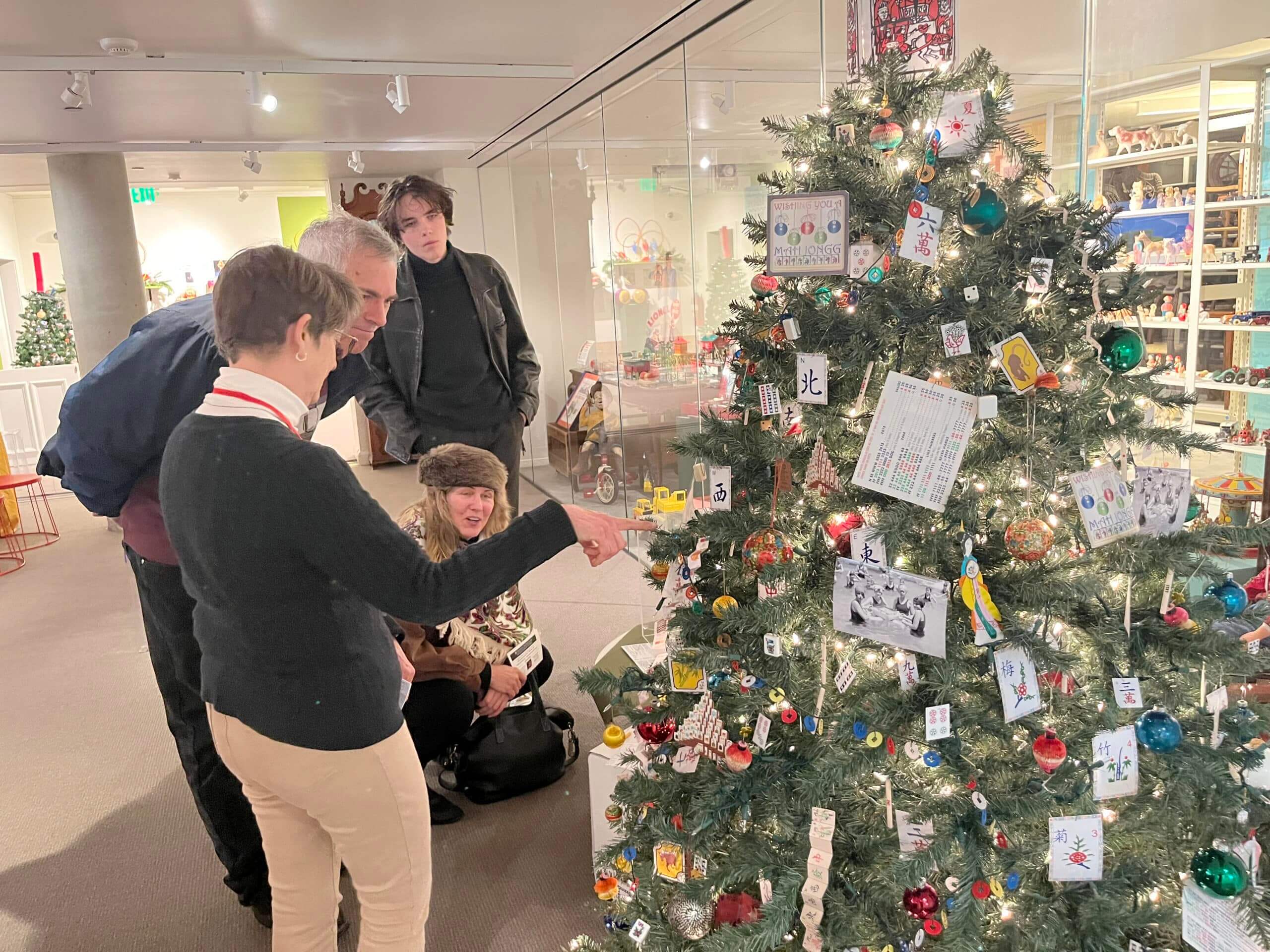 A guide describes one of the trees in the Trees of Historic Bethlehem 2023 to patrons