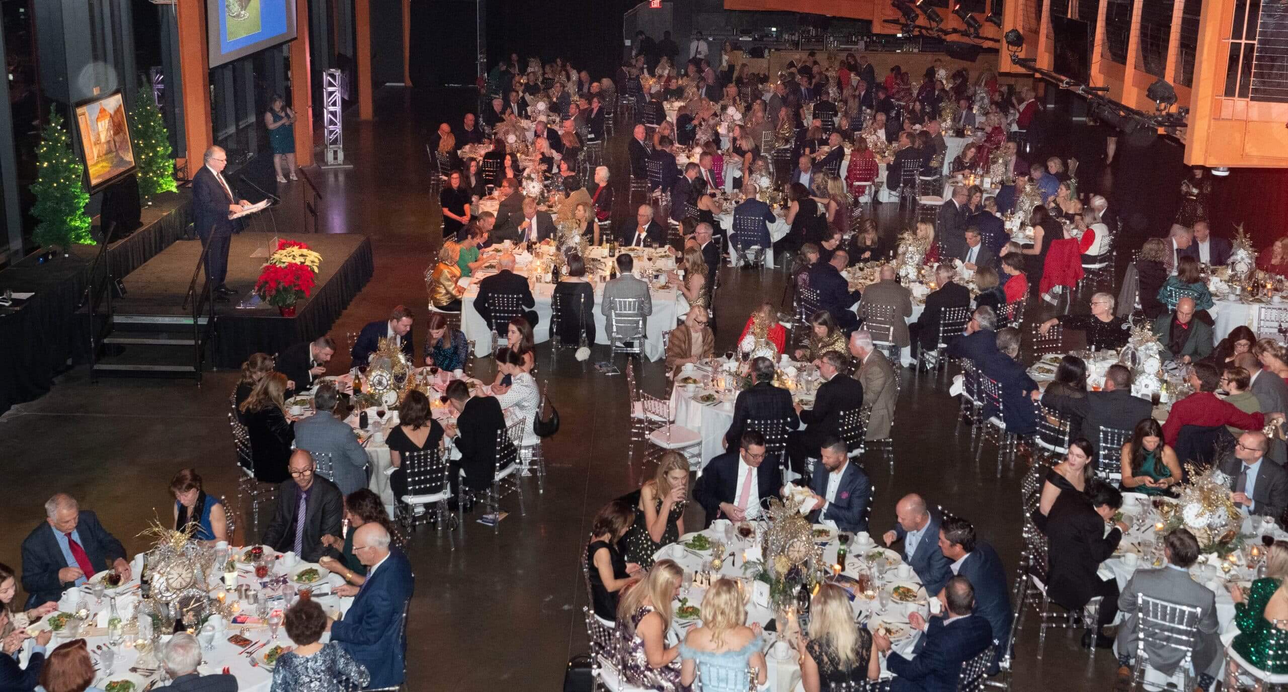 An overhead view of guests enjoying the 31st Annual Holiday Dinner & Auction