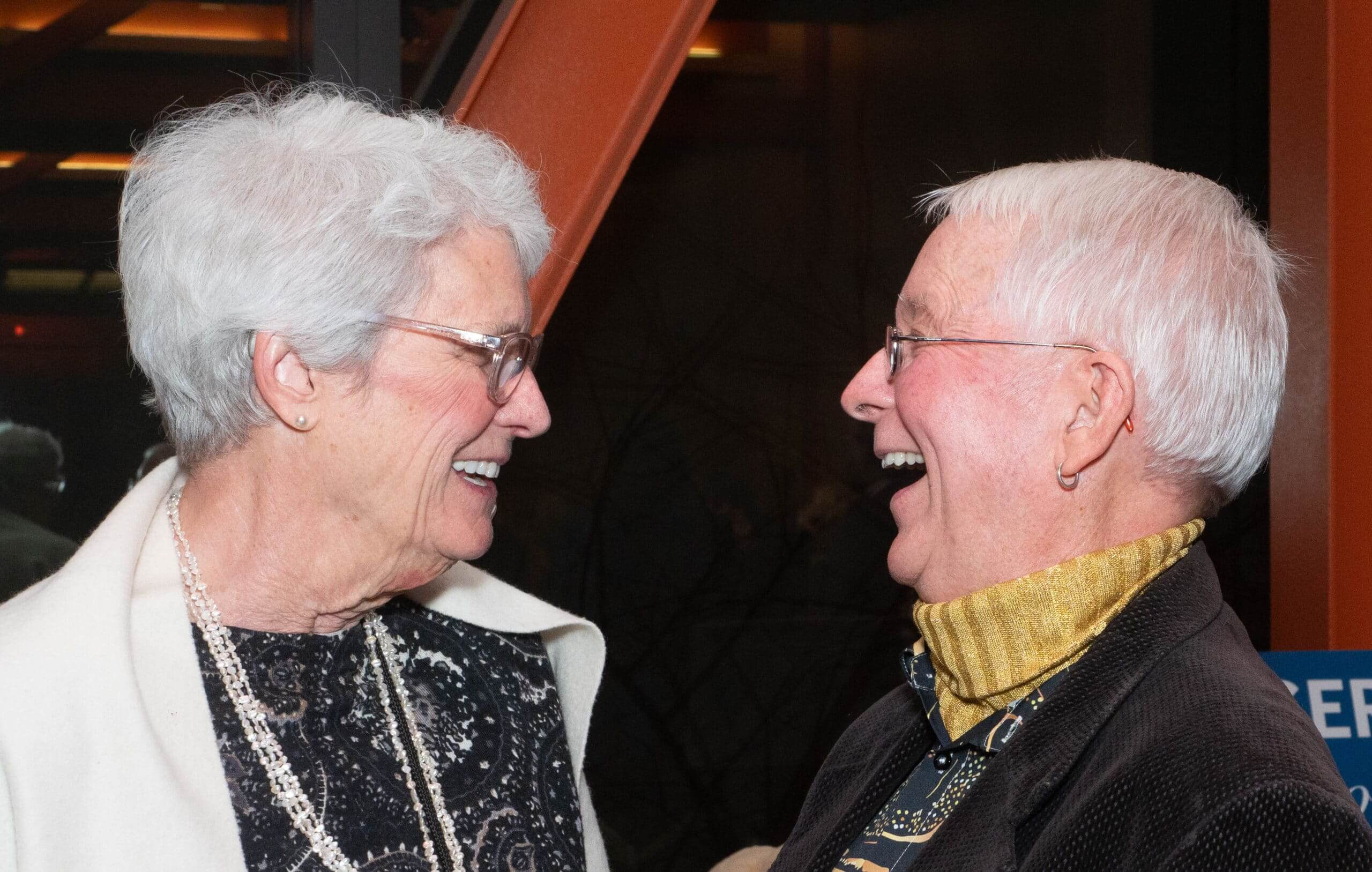 Jim and AnnMarie Whildin smiling and enjoying the Holiday Dinner & Auction