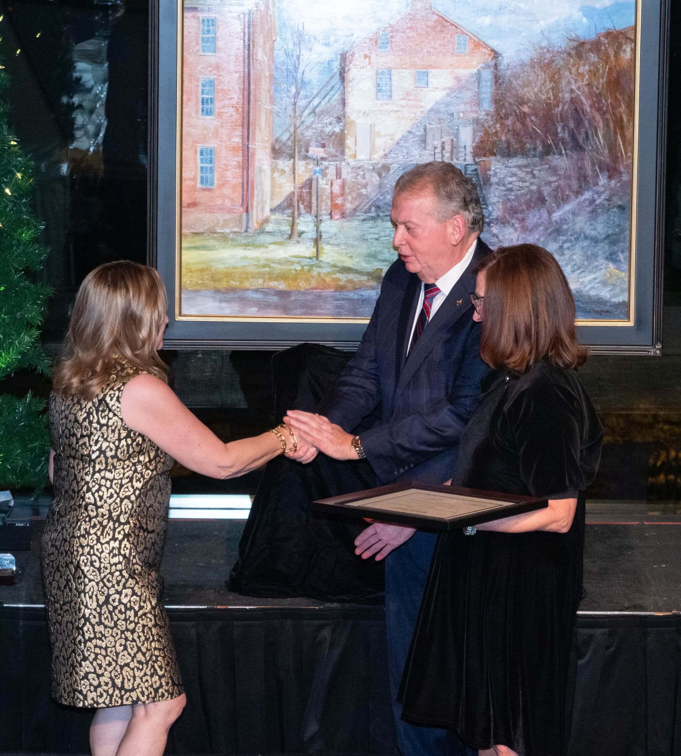 Odete Kelly accepting the Individual Honoree award at the Holiday Dinner & Auction