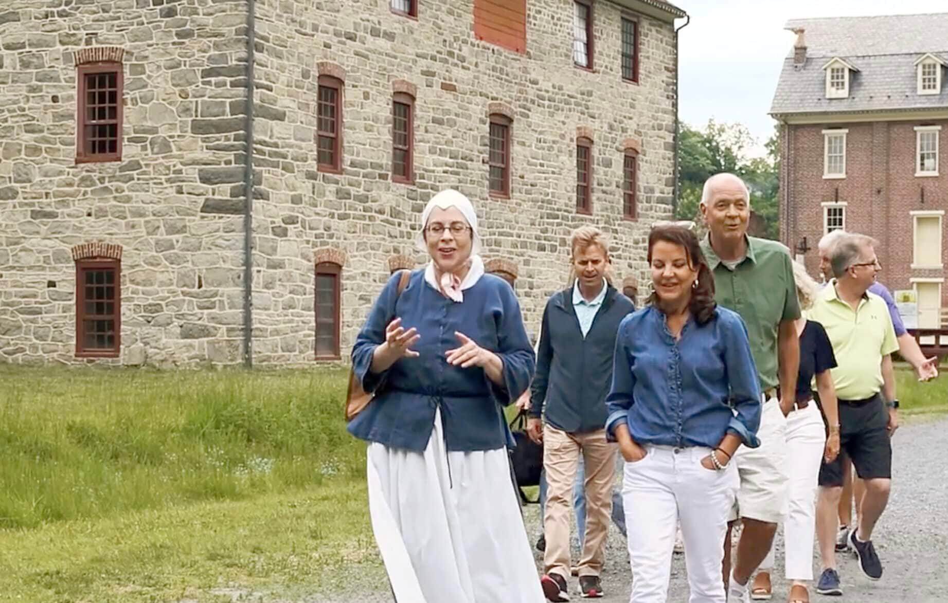 Guided walking tour passes through Colonial Industrial Quarter in Historic Bethlehem.