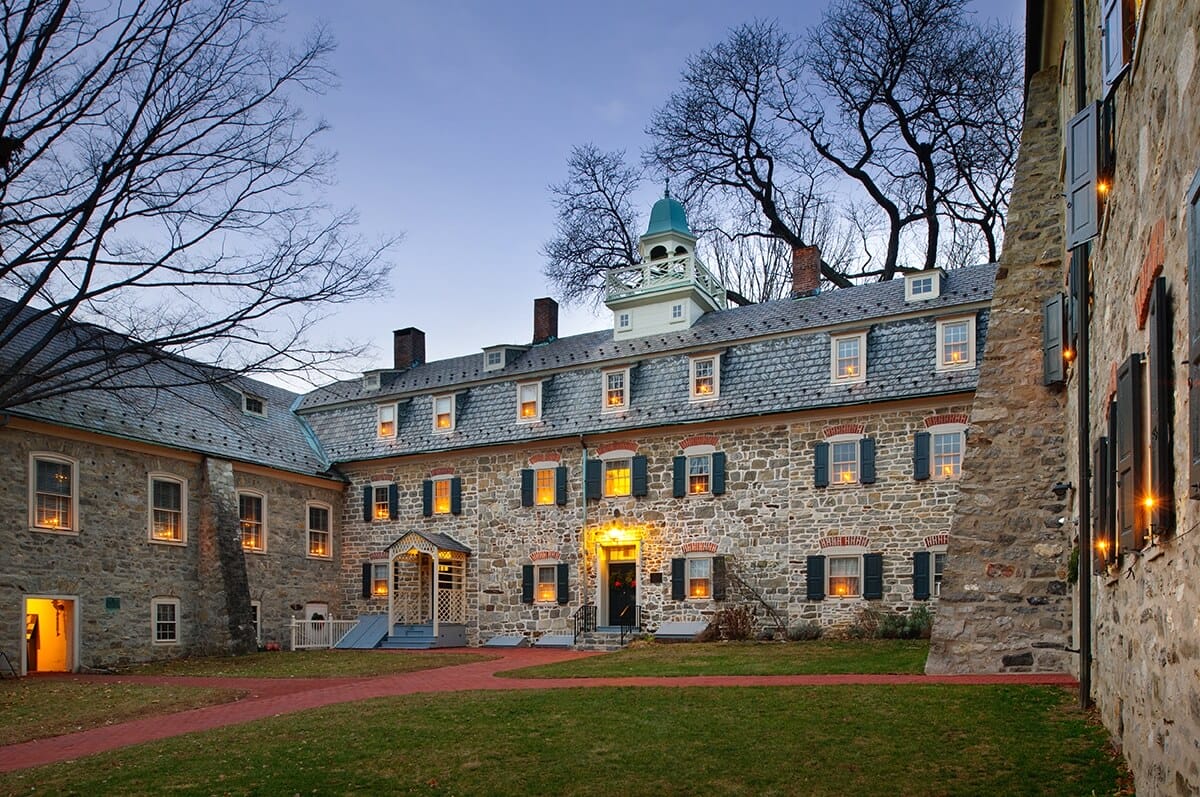 The first section of the Single Sisters’ House was constructed in 1744 parallel to the Gemeinhaus along the limestone bluff and facing south.