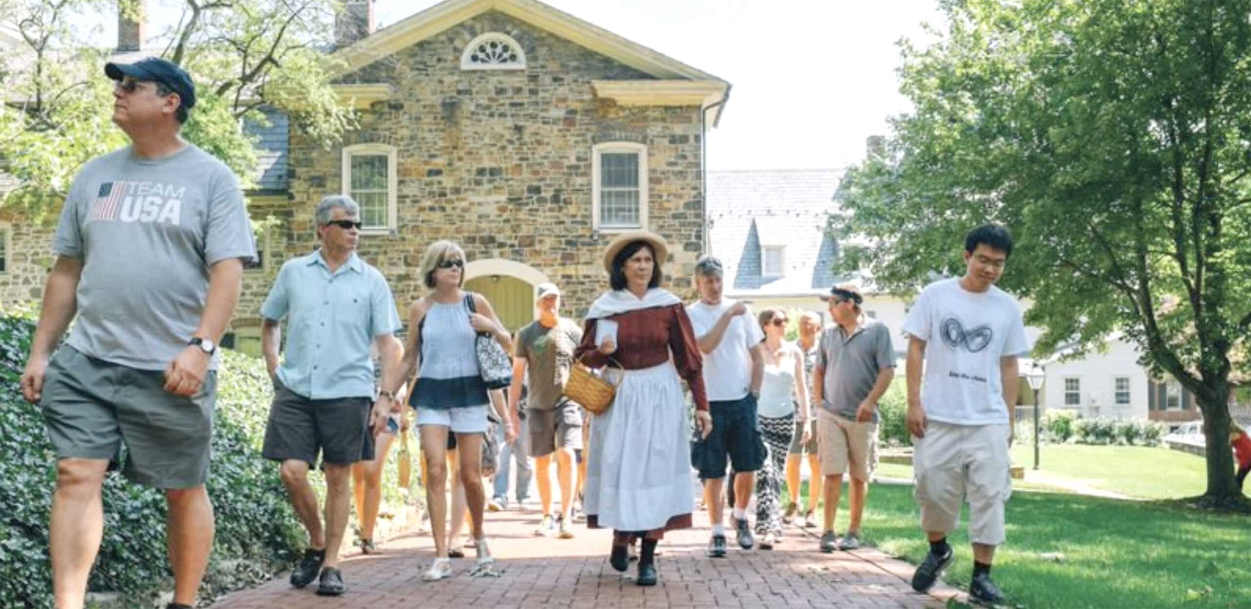 A Tour Guide and group stroll through the Historic area