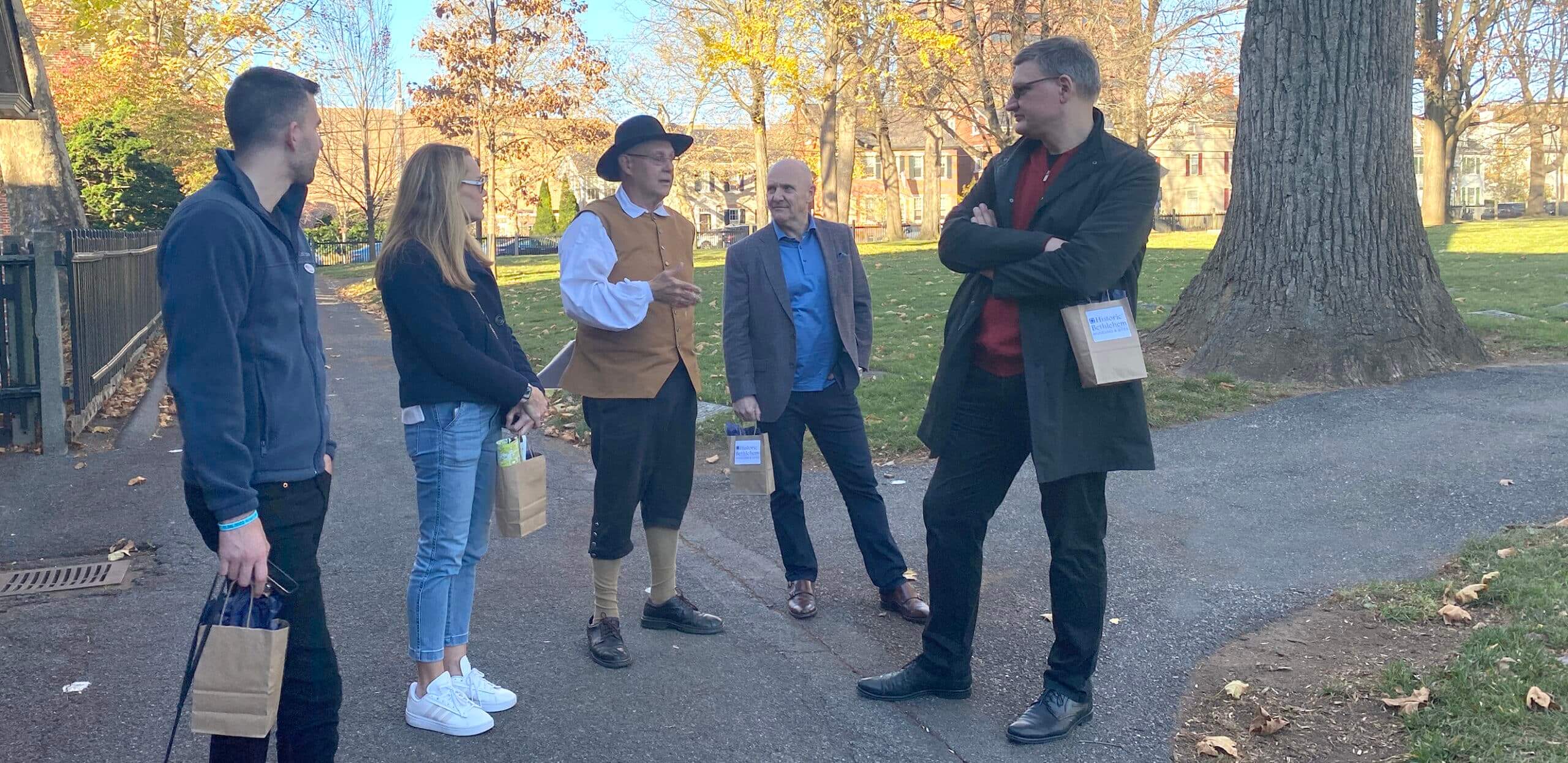 A Tour Guide hosts a group at God's Acre