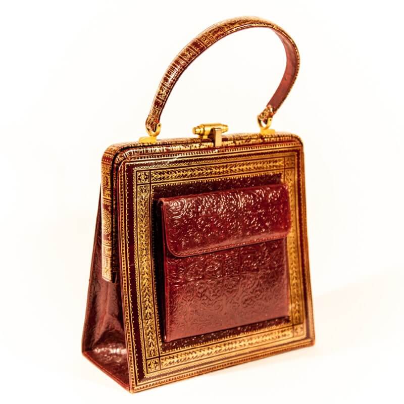 A brown, patterned handbag from Ilene Wood for the PURSEonality exhibit